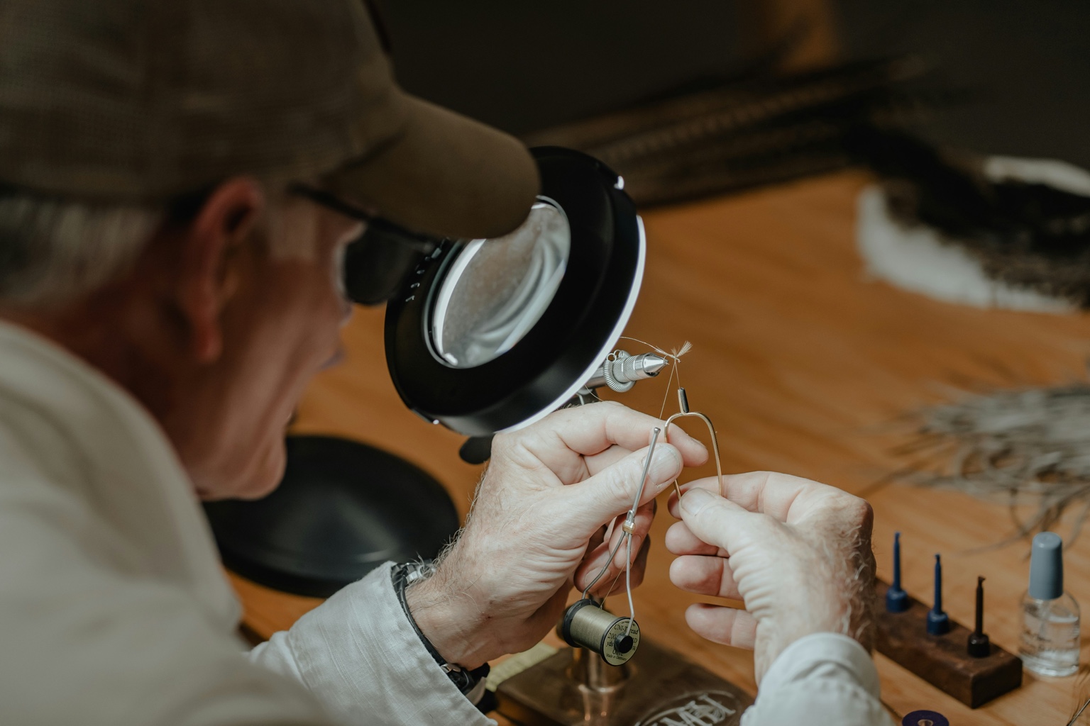 Older man tying fly - craftsmanship in action
